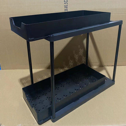 Two-tier pull-out storage rack. An organizational lifesaver for under the kitchen sink. Features adjustable shelves for easy storage of bottles and jars. In a sleek, modern design. Perfect as a kitchen shelf, bathroom organizer, or household storage solut.