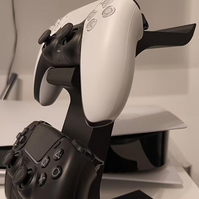 black 3-in-1 PS5 and Xbox Controller Stand – Compatible with PlayStation 5/Xbox Consoles. A gaming desktop organizer with a headphone hanger, non-charging base that holds 2 controllers and headphones. Space-saving white/black console accessory..
