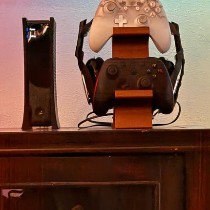 ORANGE 3-in-1 PS5 and Xbox Controller Stand – Compatible with PlayStation 5/Xbox Consoles. A gaming desktop organizer with a headphone hanger, non-charging base that holds 2 controllers and headphones. Space-saving white/black console accessory..