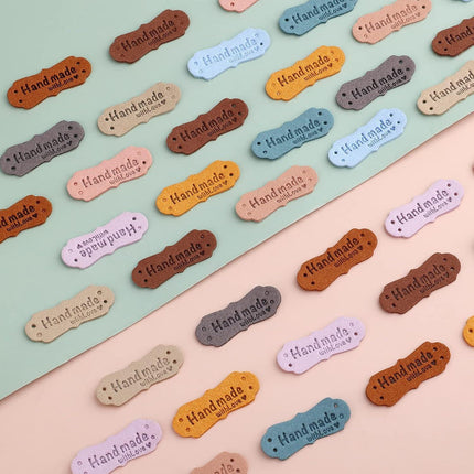 SAVITA 50 x Handmade Leather Labels with Microfibre Woven Leather Labels with Love Hearts for Crafts, Knitting, Handbags, Clothes (10 Colours).