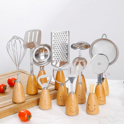Kitchen Utensil Set - 12 Piece - Includes a peeler, egg separator, spoon, fork, pizza cutter, bottle opener, spatula, slotted spoon, grater, soup ladle, whisk and toothpick holder - The perfect gift for a housewife..