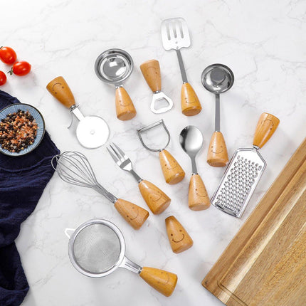 Kitchen Utensil Set - 12 Piece - Includes a peeler, egg separator, spoon, fork, pizza cutter, bottle opener, spatula, slotted spoon, grater, soup ladle, whisk and toothpick holder - The perfect gift for a housewife..