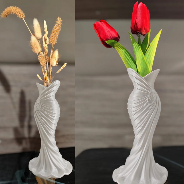 This elegant dress vase combines high-fashion elegance with minimalist home décor. Whether you insert real flowers into the glass tube or display artificial flowers without the tube, it is exceptionally beautiful..