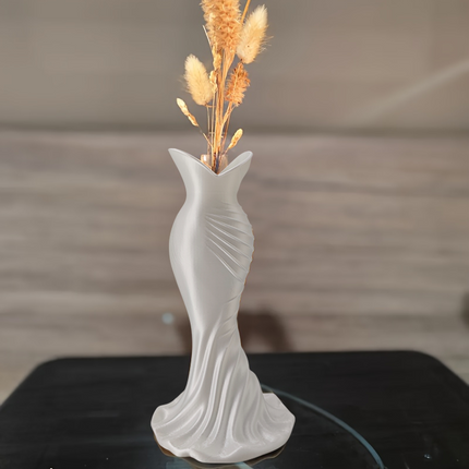 This elegant dress vase combines high-fashion elegance with minimalist home décor. Whether you insert real flowers into the glass tube or display artificial flowers without the tube, it is exceptionally beautiful..