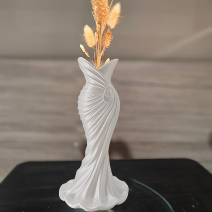 This elegant dress vase combines high-fashion elegance with minimalist home décor. Whether you insert real flowers into the glass tube or display artificial flowers without the tube, it is exceptionally beautiful..
