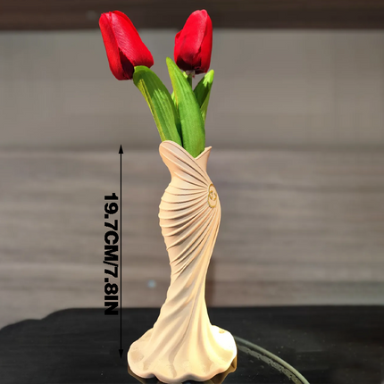 This elegant dress vase combines high-fashion elegance with minimalist home décor. Whether you insert real flowers into the glass tube or display artificial flowers without the tube, it is exceptionally beautiful..
