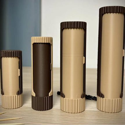 Compact 3D-printed rotating organizer capsule, 1.3 inches long x 4.1 inches high..