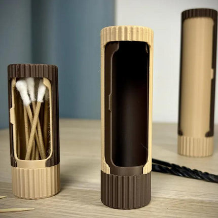 Compact 3D-printed rotating organizer capsule, 1.3 inches long x 4.1 inches high..