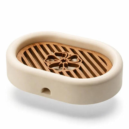 3D-printed oval soap dish with drain rack, white and wood-look..