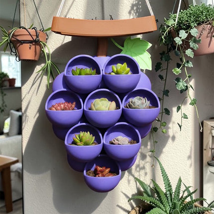 3D-printed grape pots in purple, brown, and green..