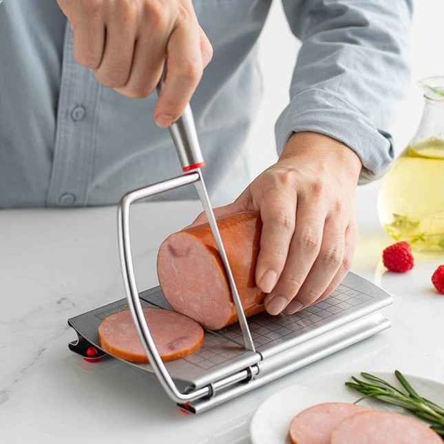 A stainless steel cheese slicer with scales-With scale.