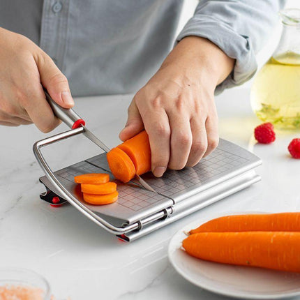A stainless steel cheese slicer with scales-With scale.
