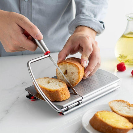 A stainless steel cheese slicer with scales-With scale.
