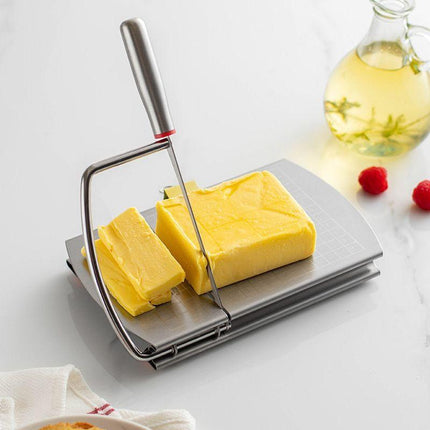 A stainless steel cheese slicer with scales-With scale.