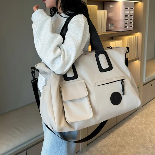 White Large-capacity travel tote bag, lightweight carry-on luggage with shoulder strap, gym bag, portable laptop bag, ideal for short trips, hand-carry style..