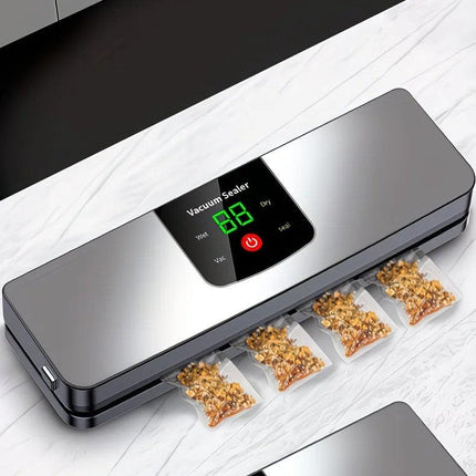 silver Rechargeable Vacuum Sealer with USB Port, designed for preserving food in both dry and wet environments, equipped with an LED screen, ideal for travel and camping..