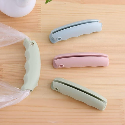 3-Piece Shopping Bag Handles Set - Blue Green Pink - Soft Padded Silicone Grips with Keyhole - Anti-Slip Comfortable Kitchen Gadget for Easy Shopping.
