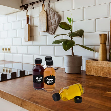 12 Pack 2oz Small Clear Glass Bottles with Caps, 60ml Glass Juice Bottles, Wellness Shot Bottles with Funnels, Stickers and Brush, Mini Liquor Bottles for Juice, Water, Ginger, Whiskey, Potion, Sample.