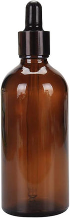 Compact Lightweight Tan Glass Dropper Bottle with Black Cap for Essential Oils and Perfume Travel.