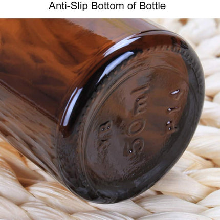 Compact Lightweight Tan Glass Dropper Bottle with Black Cap for Essential Oils and Perfume Travel.