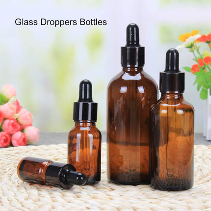 Compact Lightweight Tan Glass Dropper Bottle with Black Cap for Essential Oils and Perfume Travel.