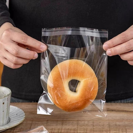Cellophane bags - 100 small clear cellophane cookie bags - food safe - sealed with clear self-adhesive OPP display seal for cookies, lollies, envelopes, gifts, cards and photos (10 x 15 cm).