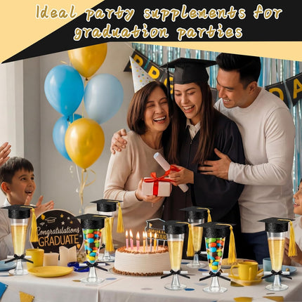 24 Sets 2026 Graduation Party Decoration Plastic Champagne Flutes Mini Grad Cap Bottle Toppers Goblet Covers with Tassel and Scroll Diploma Black Bow DIY Graduation Cap Favors for Table Decor.