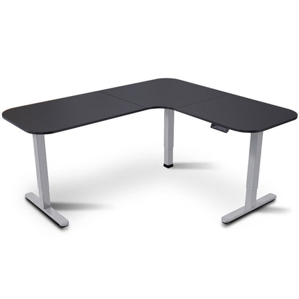 FORTIA Corner Standing Desk, 160x140cm, 72-118cm Sit to Stand Up Electric Height Adjustable, Black Desktop/Silver Frame.