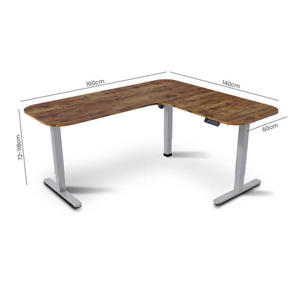 FORTIA Corner Standing Desk, 160x140cm, 72-118cm Sit to Stand Up Electric Height Adjustable, Walnut Style Desktop/Silver Frame.