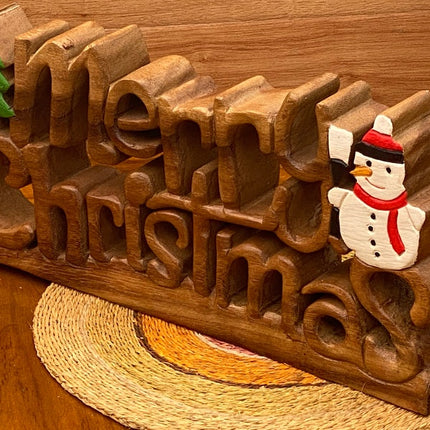 Wooden carved Merry Christmas decoration 38 cm long with Tree and Star.