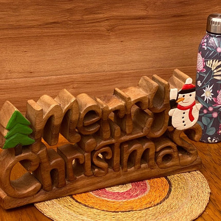 Wooden carved Merry Christmas decoration 38 cm long with Tree and Star.