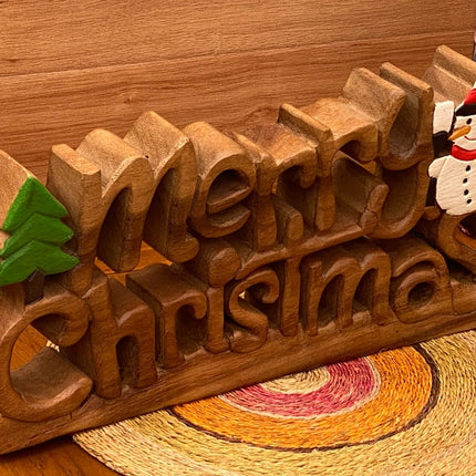 Wooden carved Merry Christmas decoration 38 cm long with Tree and Star.