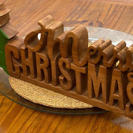 Wooden carved Merry Christmas decoration 38 cm long with Tree and Star.