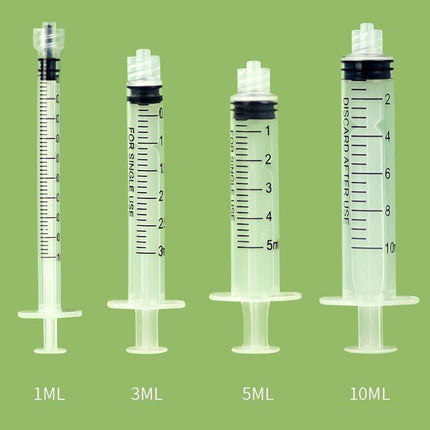 Kitten Feeding Bottle with Syringe Dispenser for Young Pets and Small Animals.