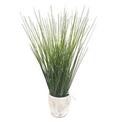 Artificial Grass in cement vase.