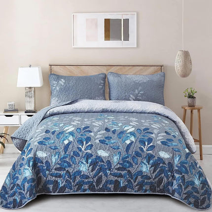 Blue Garden Coverlet Set with Quilted Floral Pattern and Pillowcases.