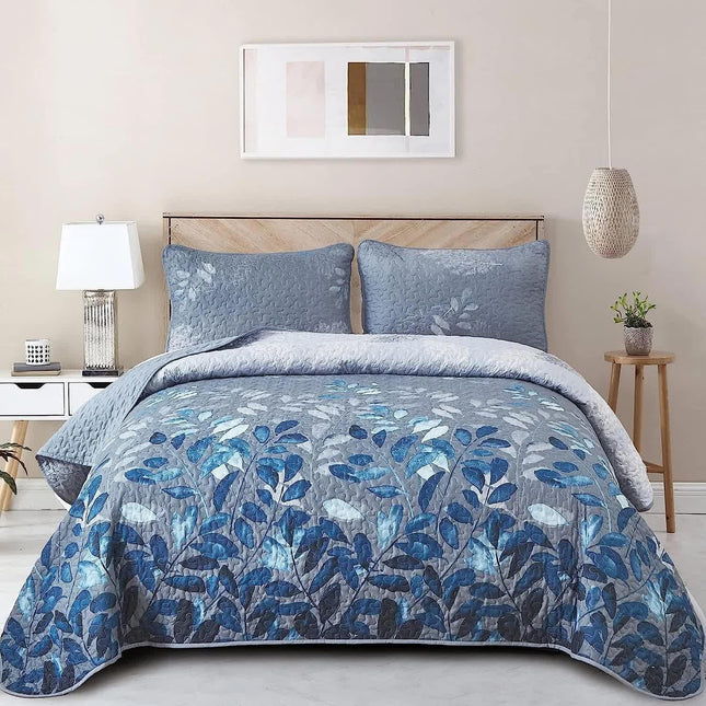Blue Garden Coverlet Set with Quilted Floral Pattern and Pillowcases.
