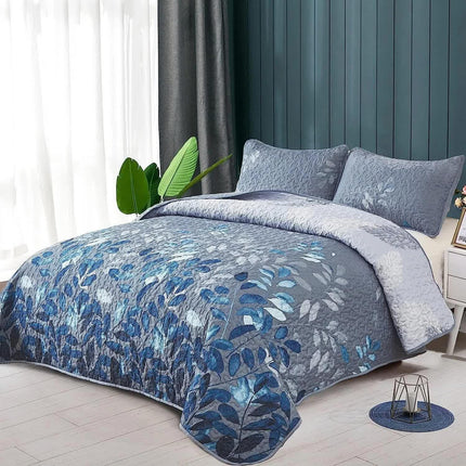 Blue Garden Coverlet Set with Quilted Floral Pattern and Pillowcases.