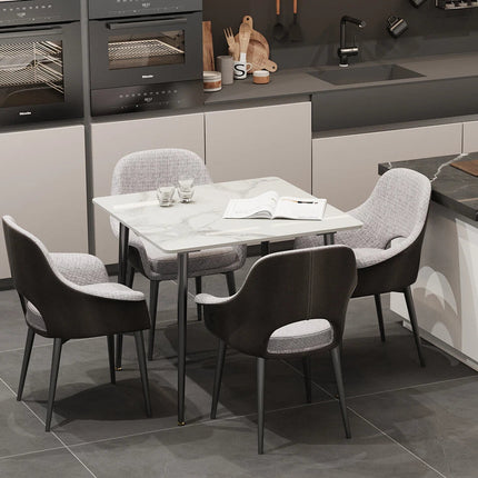 White Sintered Stone Dining Table With Black Legs For Modern Interiors.