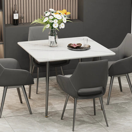White Sintered Stone Dining Table With Black Legs For Modern Interiors.