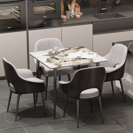 Glossy White Sintered Stone Dining Table With Black Metal Base Frame.