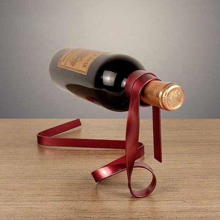 Red Modern Ribbon Wine Bottle Holder - Creative Floating Wine Rack for Home and Bar Décor.