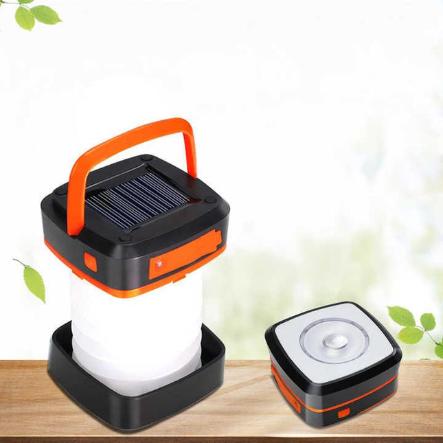 Orange Collapsible Portable Solar LED Camping Lantern with USB Charging.