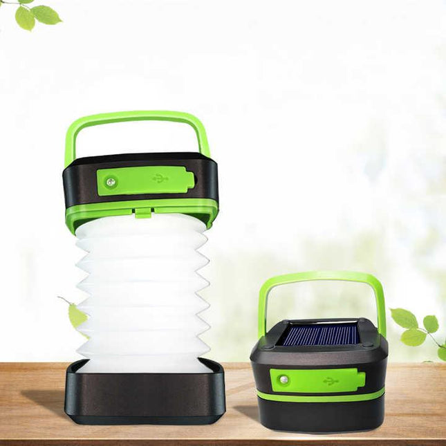 Green Collapsible Portable Solar LED Camping Lantern with USB Charging.