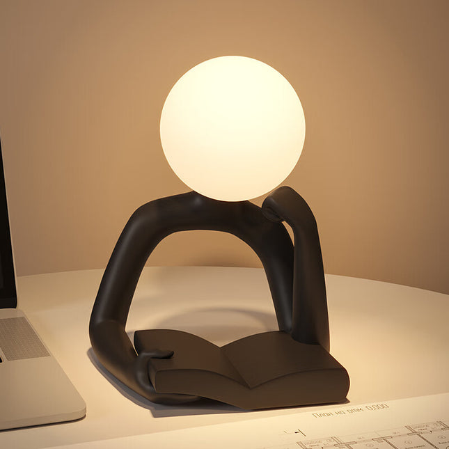 Black Creative Book Reader Desk Lamp - USB Powered, Modern Resin Design.