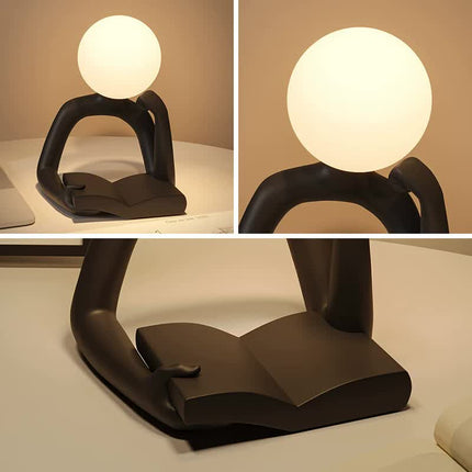 Black Creative Book Reader Desk Lamp - USB Powered, Modern Resin Design.