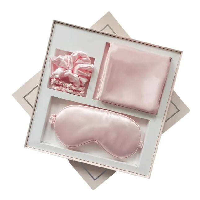 Pink Luxury Faux Silk Sleep Gift Set - 4-Piece Eye Mask, Pillowcase & Scrunchies for Relaxation & Comfort.