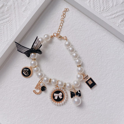 Black 4-PCS Pearl Charm Pet Necklace - Adjustable Bowknot Collar for Small Dogs & Cats (S: 20+5CM).