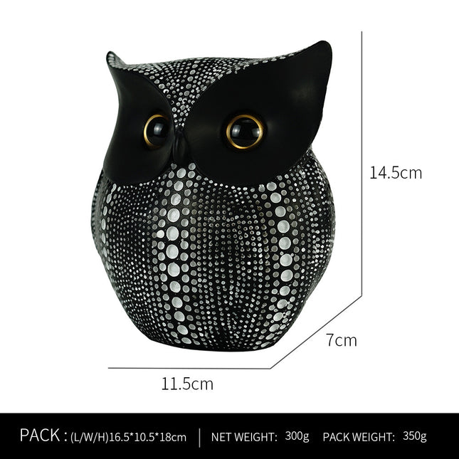 Black resin owl statue - modern perforated design for living room TV cabinet and entryway decoration.