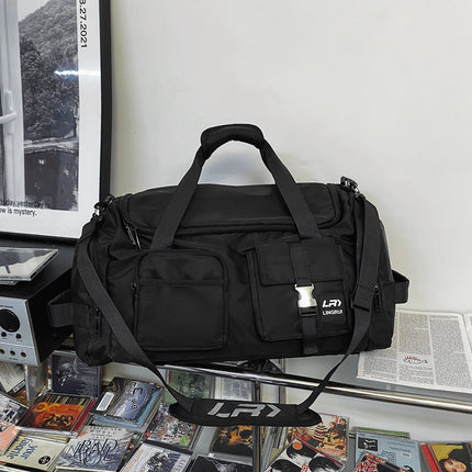 Black Unisex Travel Bag with Utility Buckles and Wet/Dry Compartments.